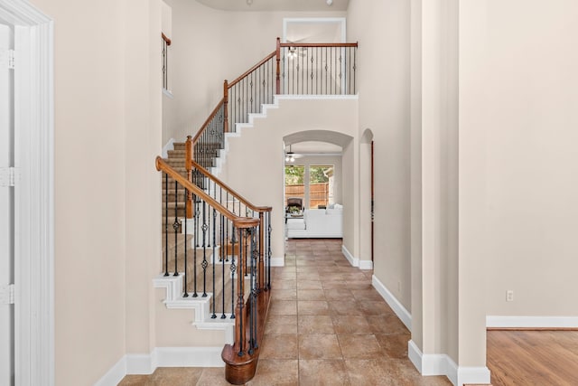 15372 Mountain View Ln, Frisco, TX 75035 - foyer with arched walkways, stairway, baseboards, and a towering ceiling