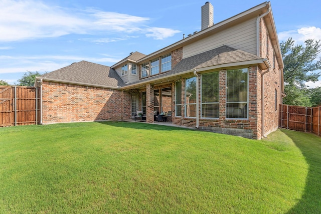 15372 Mountain View Ln, Frisco, TX 75035 - back of house featuring brick siding, a shingled roof, and a chimney