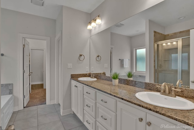 2087 Sand Crest Dr, Shreveport, LA 71118 - bathroom with a shower stall, double vanity, tile patterned floors, a garden tub, and baseboards
