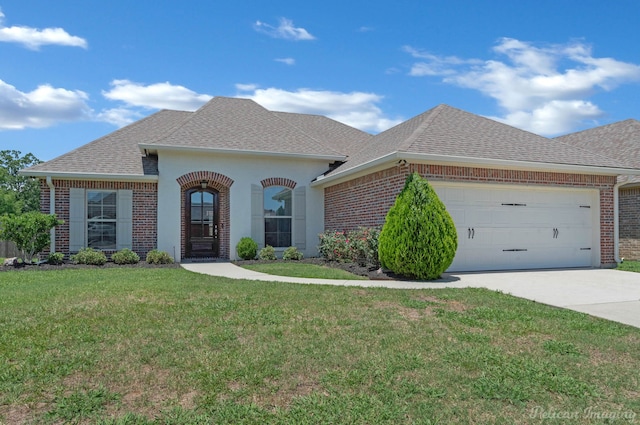 2087 Sand Crest Dr, Shreveport, LA 71118 - french country inspired facade featuring brick siding, a shingled roof, a front yard, a garage, and concrete driveway