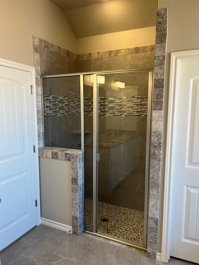 554 Calla Lily Dr, Tolar, TX 76476 - full bathroom with a shower stall and lofted ceiling