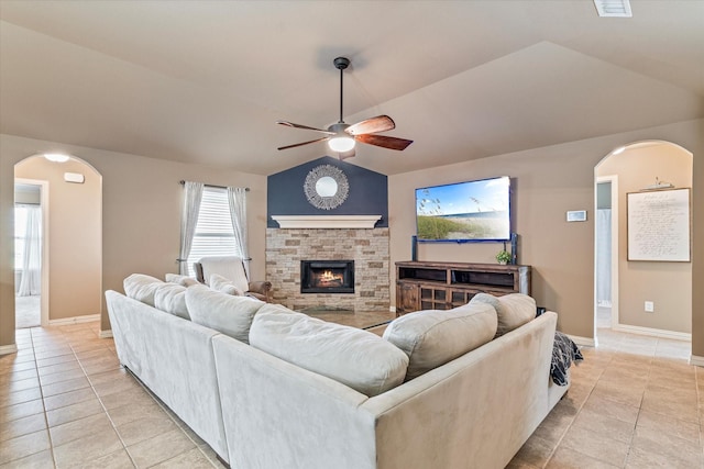 3007 Glenwood Ct, Aubrey, TX 76227 - living area with light tile patterned floors, ceiling fan, lofted ceiling, arched walkways, and baseboards