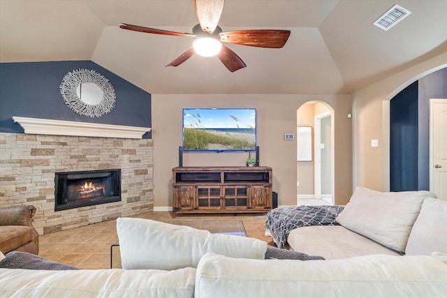 3007 Glenwood Ct, Aubrey, TX 76227 - tiled living area with lofted ceiling, ceiling fan, arched walkways, and a fireplace