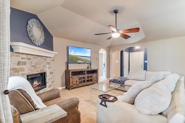 3007 Glenwood Ct, Aubrey, TX 76227 - living room featuring arched walkways, a ceiling fan, light tile patterned floors, a fireplace, and lofted ceiling