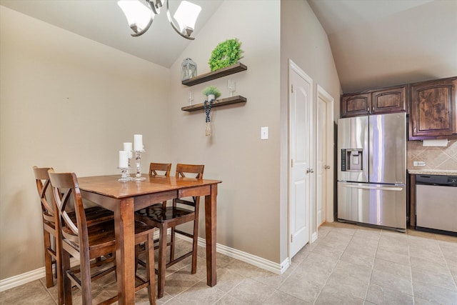 3007 Glenwood Ct, Aubrey, TX 76227 - dining area with lofted ceiling, baseboards, light tile patterned flooring, and a chandelier