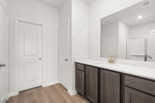 409 Gib Woodall Dr, Venus, TX 76084 - bathroom with wood finished floors, vanity, and baseboards