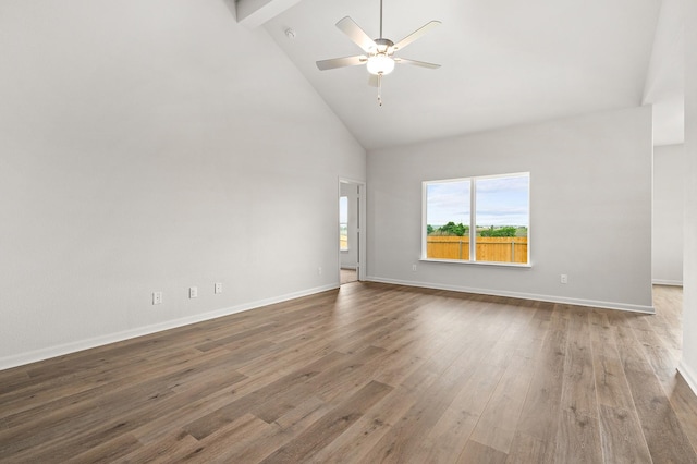 409 Gib Woodall Dr, Venus, TX 76084 - spare room featuring high vaulted ceiling, ceiling fan, wood finished floors, baseboards, and beam ceiling