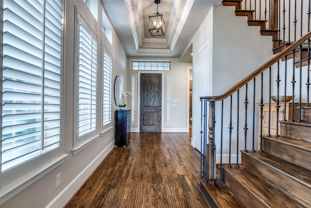 4540 Honeyvine Ln, Prosper, TX 75078 - entrance foyer featuring plenty of natural light, a chandelier, wood finished floors, stairway, and crown molding