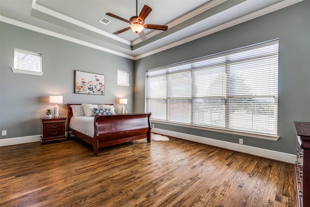4540 Honeyvine Ln, Prosper, TX 75078 - bedroom with a raised ceiling, crown molding, multiple windows, wood finished floors, and baseboards