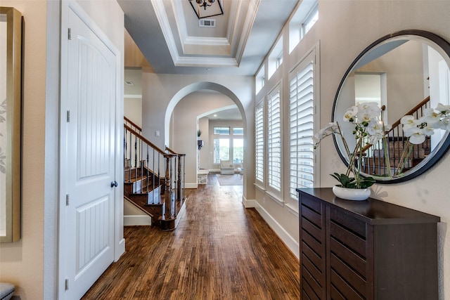 4540 Honeyvine Ln, Prosper, TX 75078 - foyer with dark wood-style flooring, arched walkways, stairway, baseboards, and crown molding