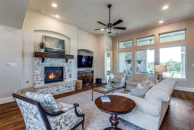 4540 Honeyvine Ln, Prosper, TX 75078 - living area with baseboards, wood finished floors, recessed lighting, ceiling fan, and a stone fireplace