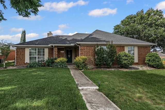 1501 Summerwind Ln, Lewisville, TX 75077 - ranch-style home featuring brick siding, a front lawn, a chimney, and roof with shingles