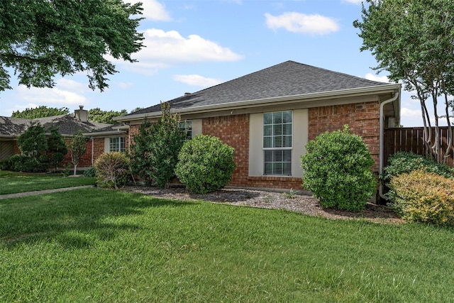 1501 Summerwind Ln, Lewisville, TX 75077 - back of property with brick siding and a shingled roof
