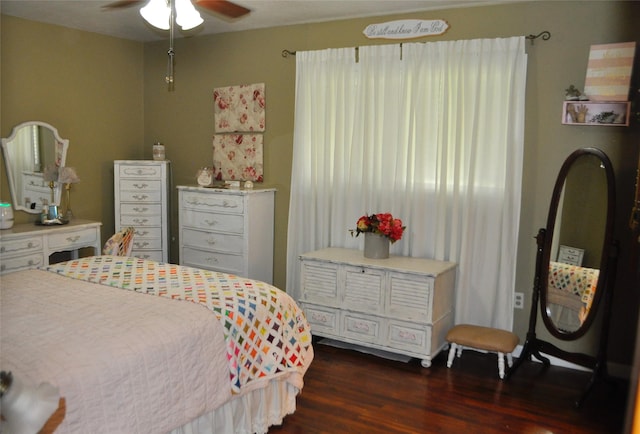 1405 Rolling Hills Dr, Graham, TX 76450 - bedroom featuring dark wood-style flooring and a ceiling fan