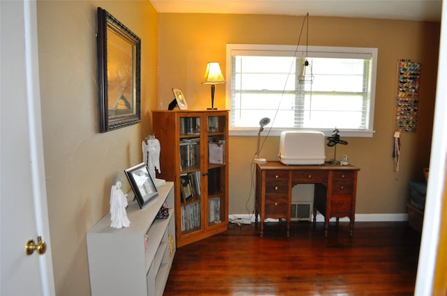 1405 Rolling Hills Dr, Graham, TX 76450 - office area featuring healthy amount of natural light, wood finished floors, and baseboards