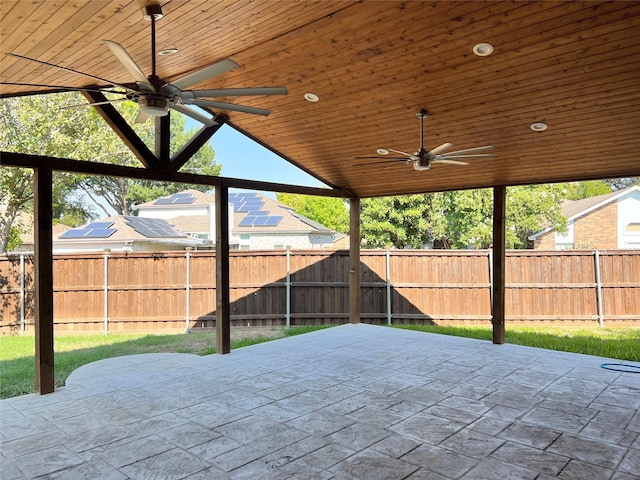 921 Granite Ln, Desoto, TX 75115 - fenced backyard with a ceiling fan and a patio area