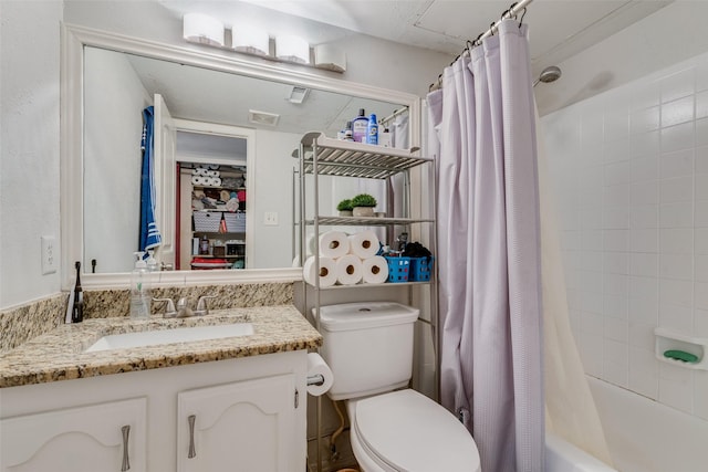 921 Granite Ln, Desoto, TX 75115 - bathroom featuring vanity, toilet, and shower / bathtub combination with curtain