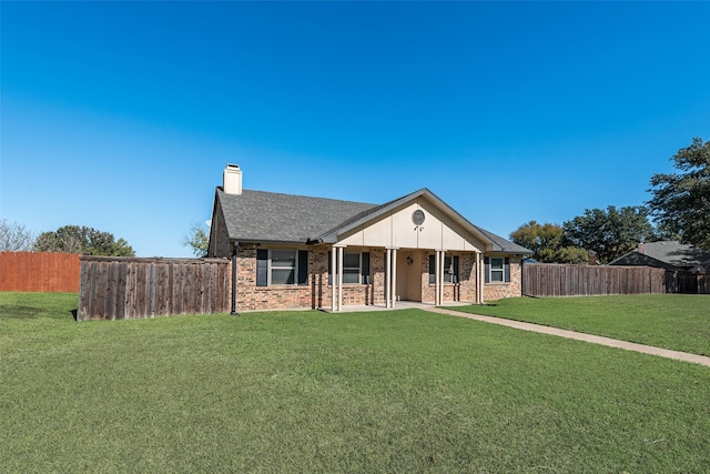921 Granite Ln, Desoto, TX 75115 - ranch-style home with a chimney, brick siding, and roof with shingles