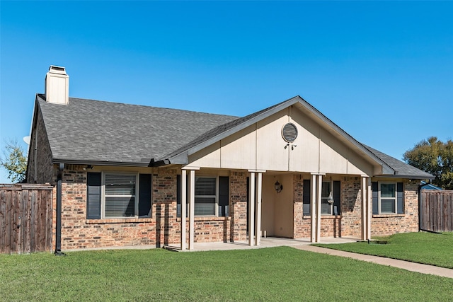 921 Granite Ln, Desoto, TX 75115 - view of front of house with brick siding, a shingled roof, a chimney, and a porch