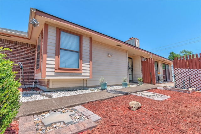 2135 Rose Cliff Ln, Carrollton, TX 75007 - view of front facade with a chimney