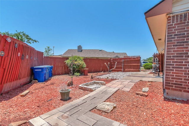 2135 Rose Cliff Ln, Carrollton, TX 75007 - fenced backyard with a patio