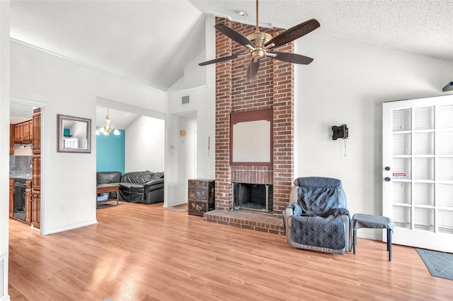2135 Rose Cliff Ln, Carrollton, TX 75007 - living area featuring a ceiling fan, light wood-type flooring, high vaulted ceiling, a brick fireplace, and baseboards