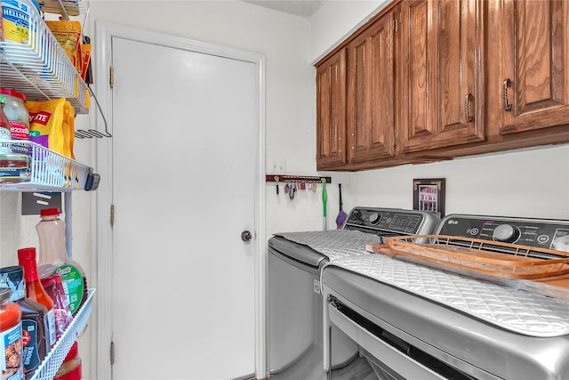 2135 Rose Cliff Ln, Carrollton, TX 75007 - washroom featuring washer and dryer and cabinet space