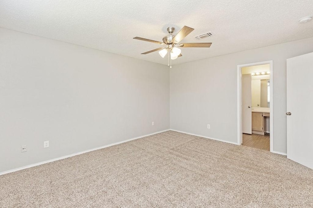 5907 Cohoke Dr, Arlington, TX 76018 - empty room with light colored carpet, a ceiling fan, baseboards, and a textured ceiling