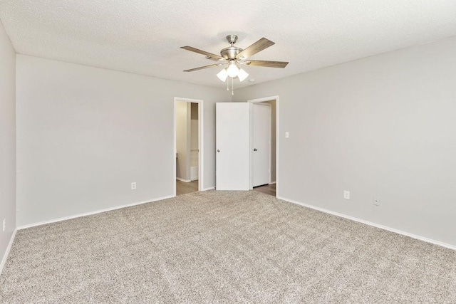 5907 Cohoke Dr, Arlington, TX 76018 - carpeted empty room with ceiling fan, baseboards, and a textured ceiling
