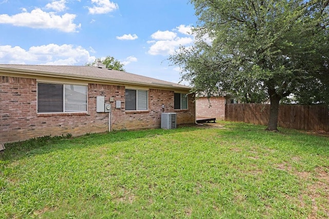 5907 Cohoke Dr, Arlington, TX 76018 - rear view of house featuring central AC unit and brick siding