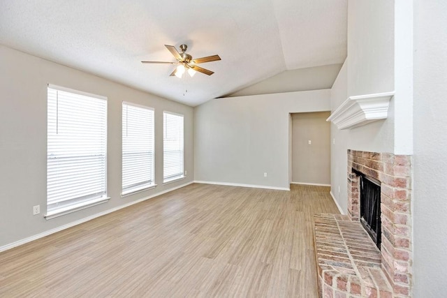 5907 Cohoke Dr, Arlington, TX 76018 - unfurnished living room featuring a fireplace, a ceiling fan, vaulted ceiling, light wood finished floors, and baseboards