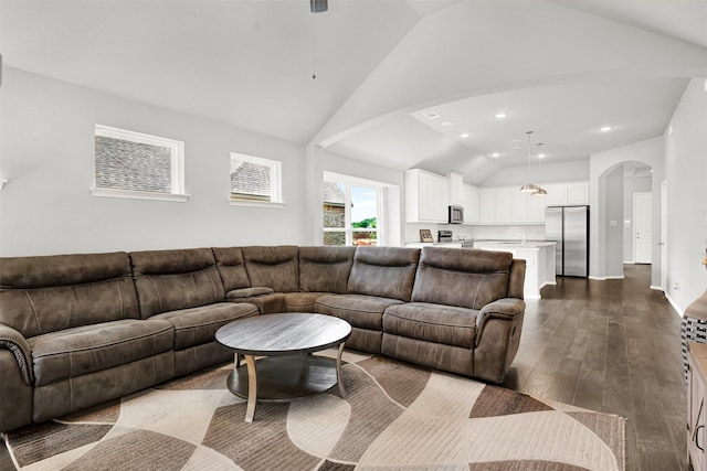 208 Rosemary Dr, Azle, TX 76020 - living room with vaulted ceiling, dark wood-style flooring, arched walkways, ceiling fan, and recessed lighting