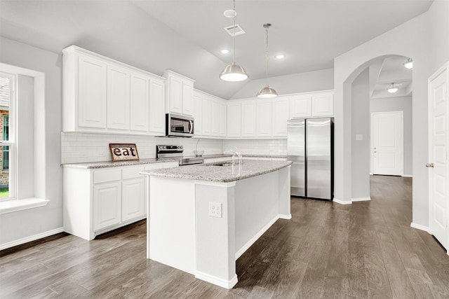 208 Rosemary Dr, Azle, TX 76020 - kitchen with appliances with stainless steel finishes, decorative backsplash, white cabinets, dark wood-type flooring, and lofted ceiling