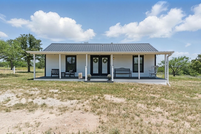 18230 Interstate 20, Cisco, TX 76437 - view of front of property with covered porch, metal roof, and a front lawn