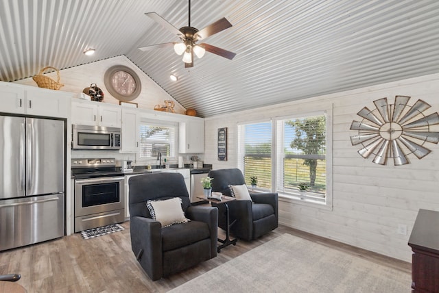 18230 Interstate 20, Cisco, TX 76437 - kitchen with stainless steel appliances, white cabinets, healthy amount of natural light, light wood-style flooring, and high vaulted ceiling