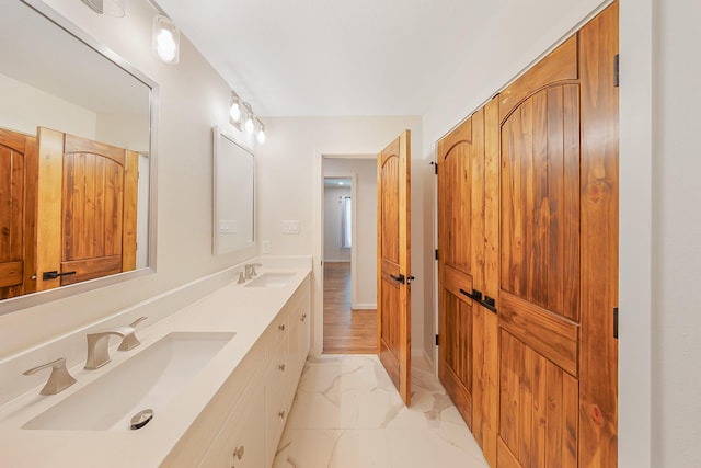 4107 Highland Rd, Melissa, TX 75454 - bathroom with marble look tiles and double vanity
