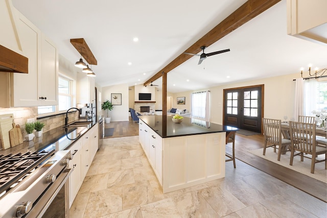 4107 Highland Rd, Melissa, TX 75454 - kitchen with a sink, stove, dark countertops, healthy amount of natural light, and recessed lighting