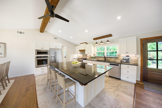 4107 Highland Rd, Melissa, TX 75454 - kitchen with stainless steel appliances, a sink, dark countertops, backsplash, and recessed lighting