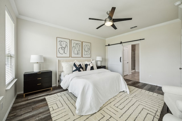 3740 Holly Brook Dr, Fort Worth, TX 76244 - bedroom featuring dark wood-type flooring, a barn door, crown molding, baseboards, and a ceiling fan