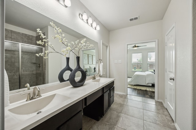 3740 Holly Brook Dr, Fort Worth, TX 76244 - bathroom with double vanity, a shower stall, a ceiling fan, ensuite bath, and baseboards