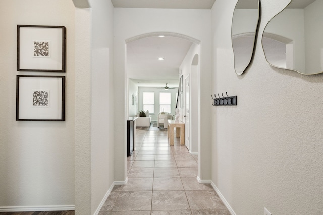 3740 Holly Brook Dr, Fort Worth, TX 76244 - corridor featuring arched walkways, light tile patterned floors, recessed lighting, and baseboards