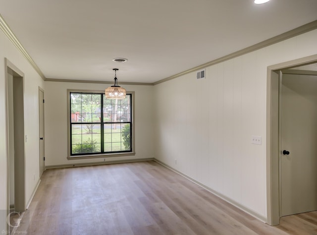 808 E St, Minden, LA 71055 - spare room featuring light wood finished floors, crown molding, baseboards, and a chandelier