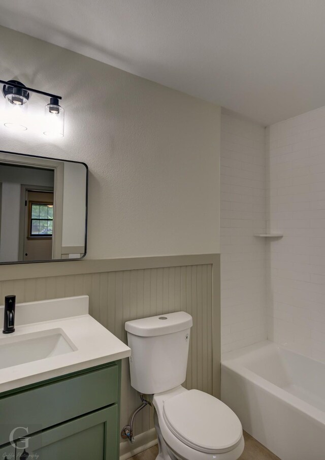 808 E St, Minden, LA 71055 - full bathroom with toilet, vanity, wainscoting, and shower / bath combination