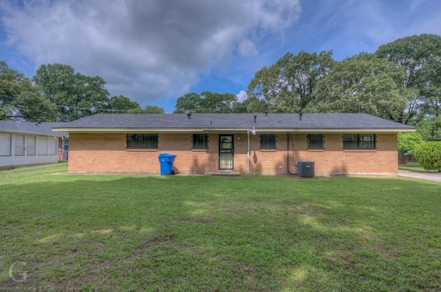 808 E St, Minden, LA 71055 - view of front of home with a front lawn, brick siding, and central air condition unit