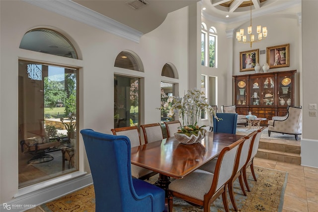 609 Enchanted Ln, Bossier City, LA 71111 - dining room featuring ornamental molding, a high ceiling, and a chandelier