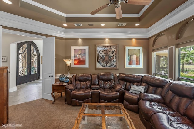 609 Enchanted Ln, Bossier City, LA 71111 - home theater with crown molding, a tray ceiling, a ceiling fan, light colored carpet, and light tile patterned floors