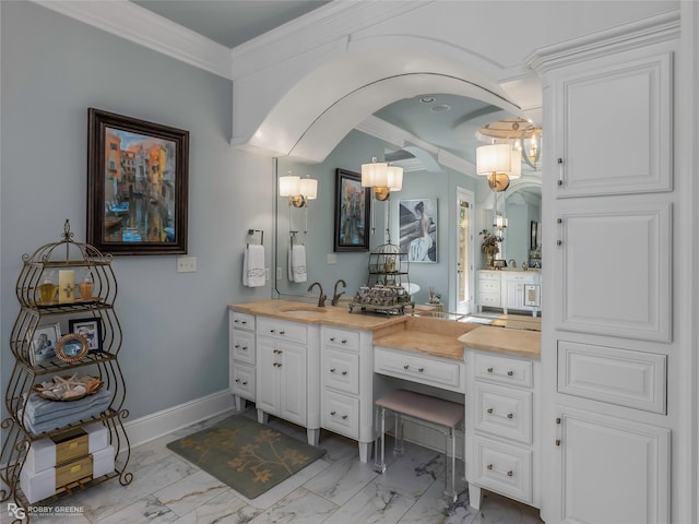 609 Enchanted Ln, Bossier City, LA 71111 - bathroom with marble finish flooring, vanity, ornamental molding, and baseboards