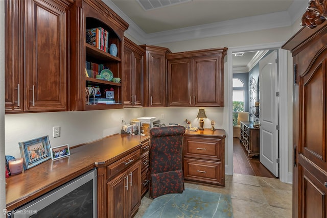 609 Enchanted Ln, Bossier City, LA 71111 - office with built in desk, beverage cooler, and crown molding
