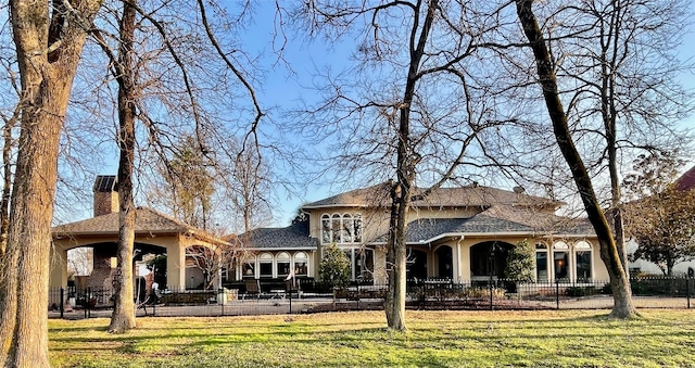 609 Enchanted Ln, Bossier City, LA 71111 - back of house with a chimney and stucco siding