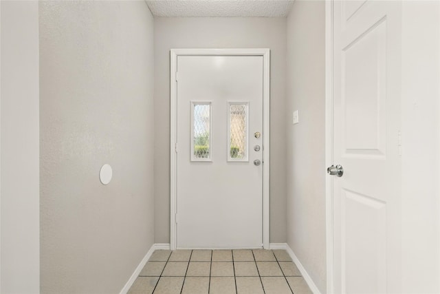 703 Inglewood Trl, Desoto, TX 75115 - entryway featuring light tile patterned flooring and baseboards